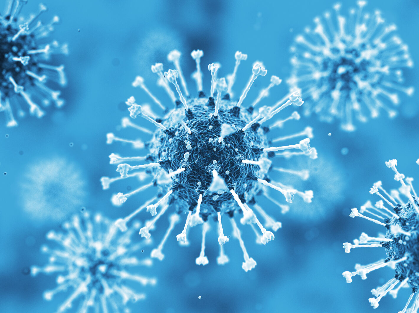Microscopic view of blue virus particles on a blurred background