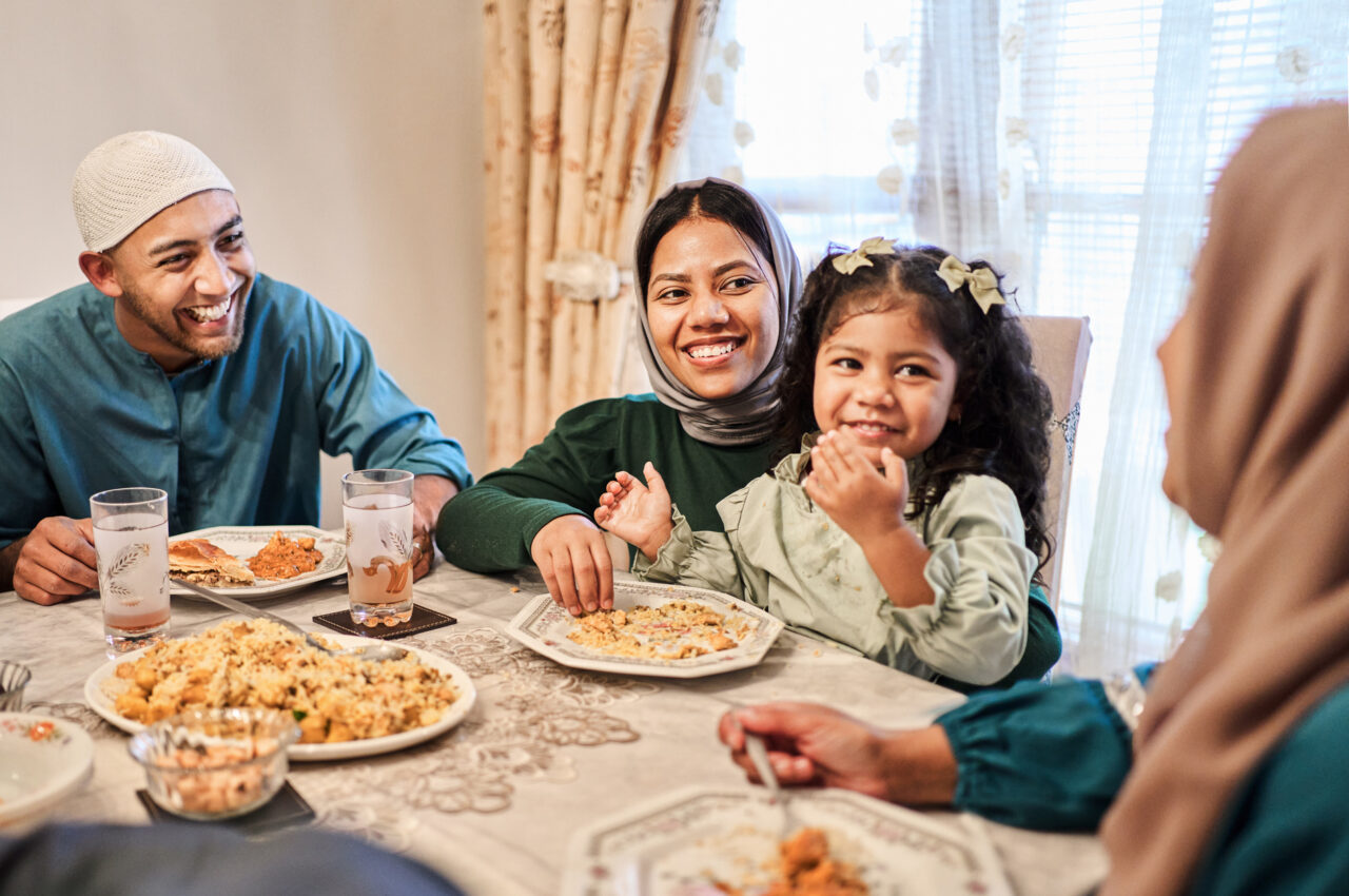 Family enjoying a meal together with smiles and laughter