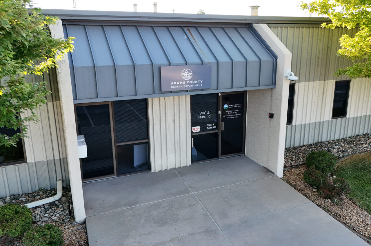 Adams County Health Department entrance with signage for WIC & Nursing, Building 4, Suite 400.