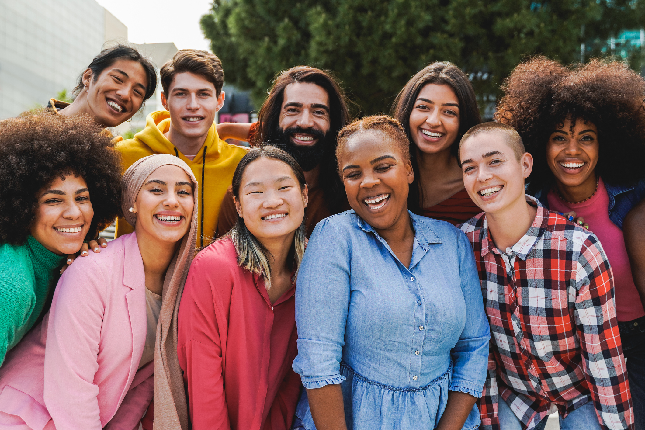 Photo of a group of people smiling outdoors